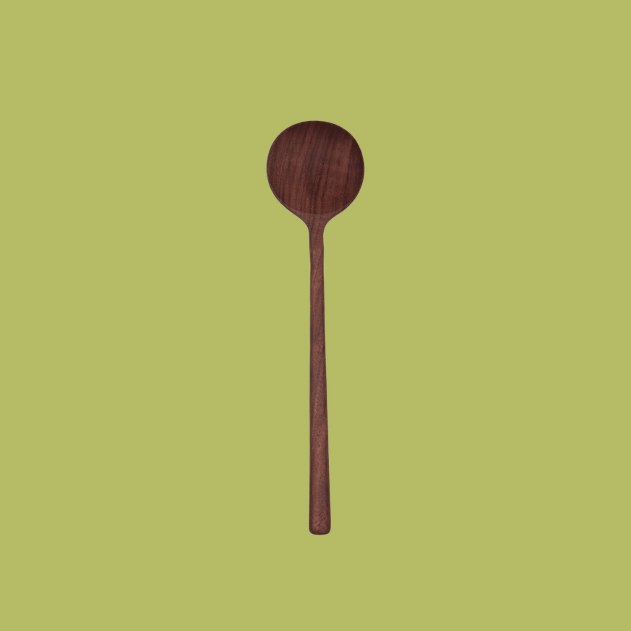 Hand crafted walnut wood spoon against green backdrop