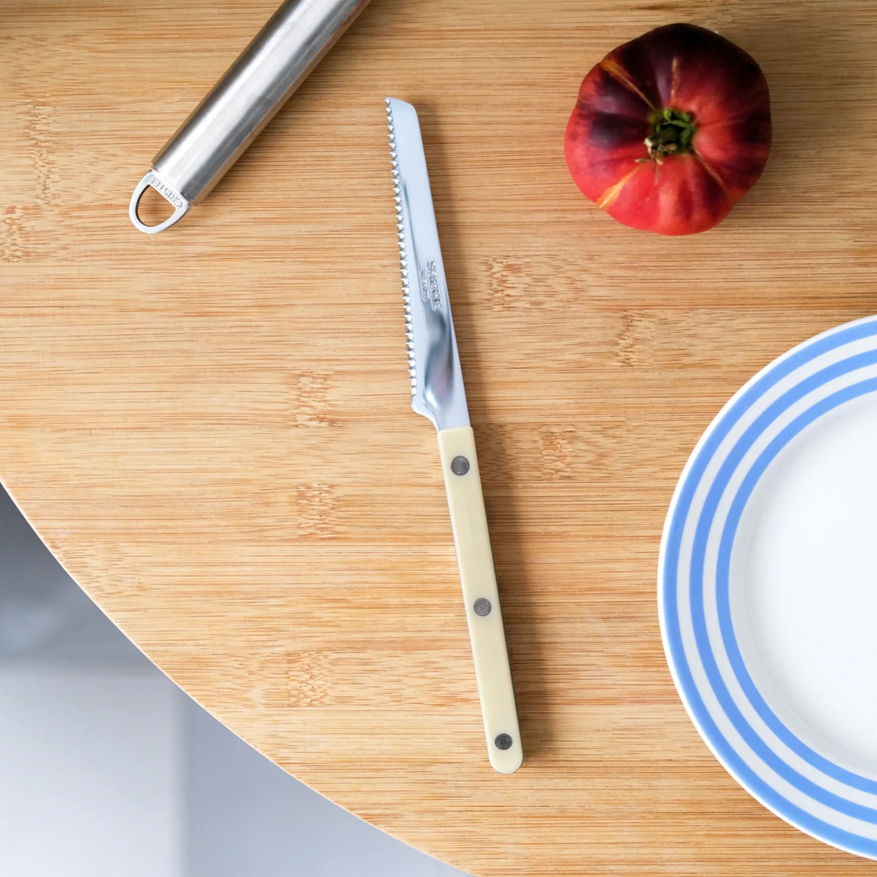 Ivory Sabre Paris Bistrot French Tomato Knife on wood table with plate
