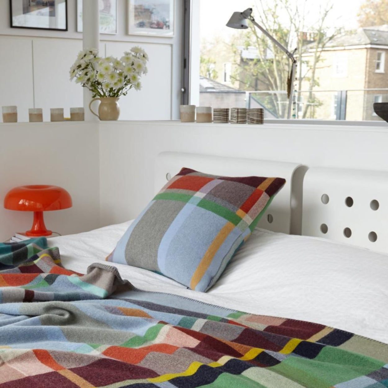 Wallace Sewell Fieldon cushion cover on bed.