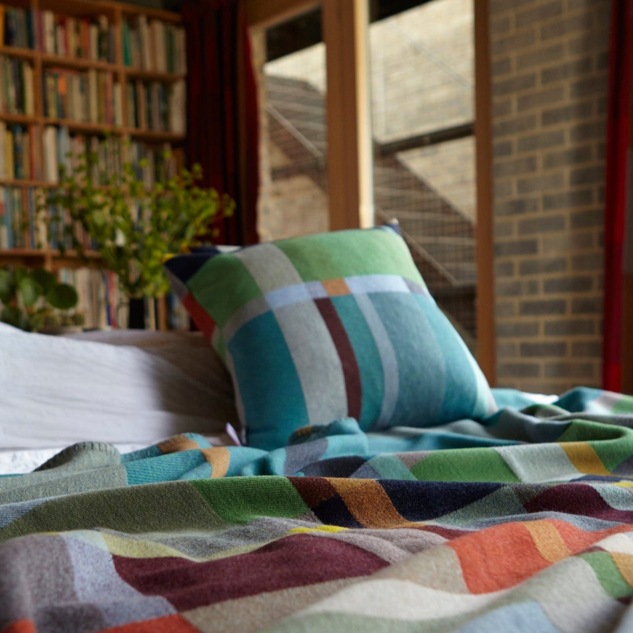 Wallace Sewell Fieldon cushion cover on bed.