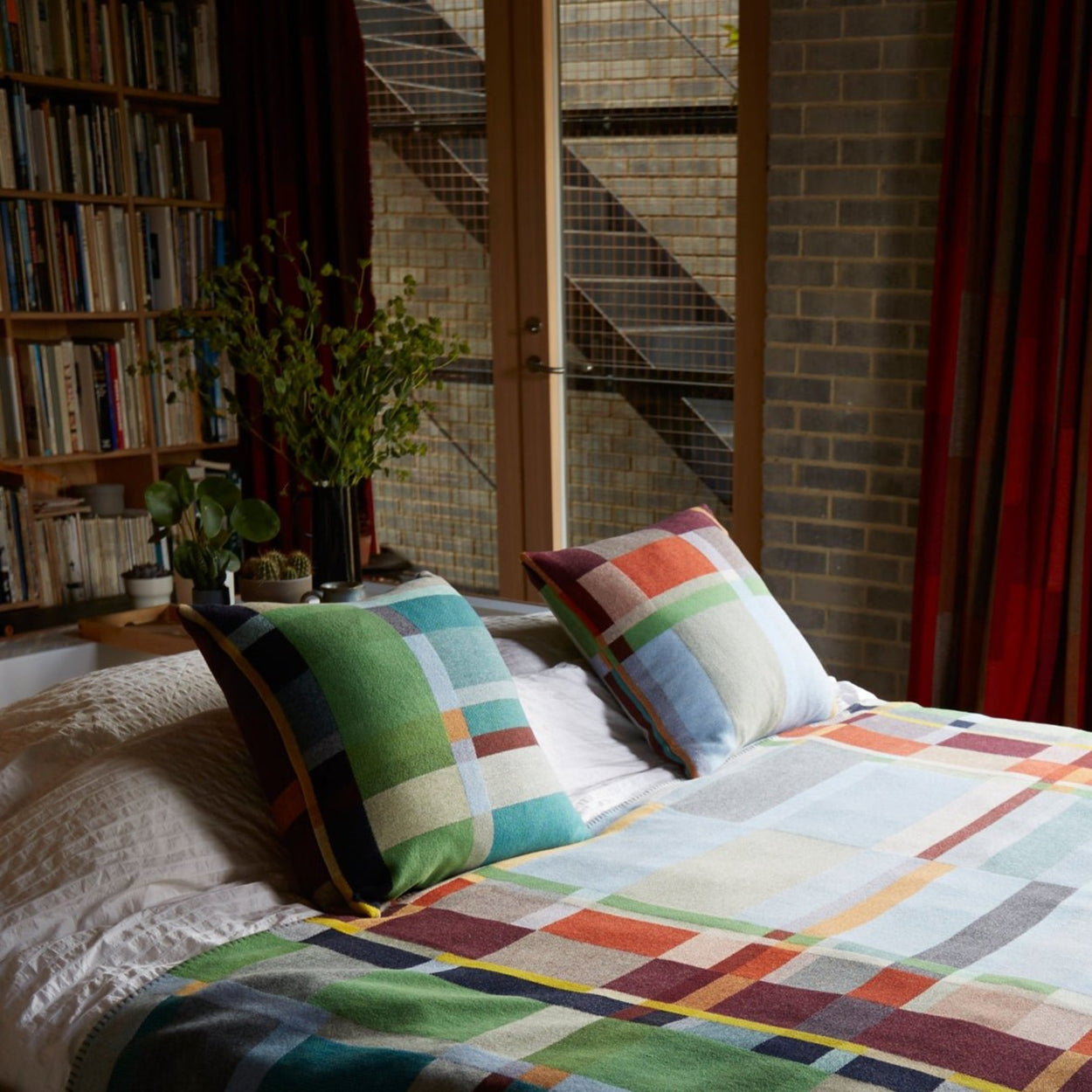 Wallace Sewell Fieldon cushion cover on bed.