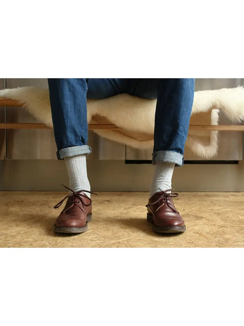 Man in jeans wearing grey Escuyer Cashmere Wool Socks
