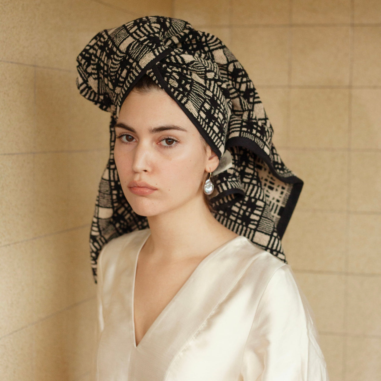 Woman with pearl earring with Autumn Sonata Bath Towel - Alma wrapped around her head