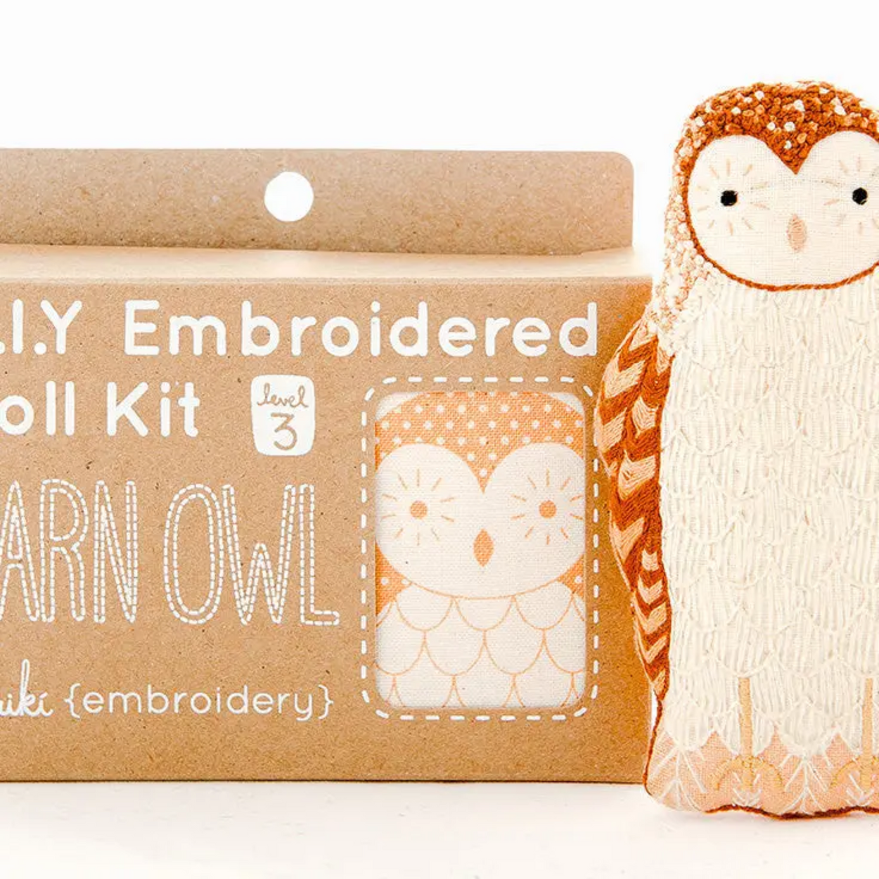 Embroidered owl kit with packaging on a white background
