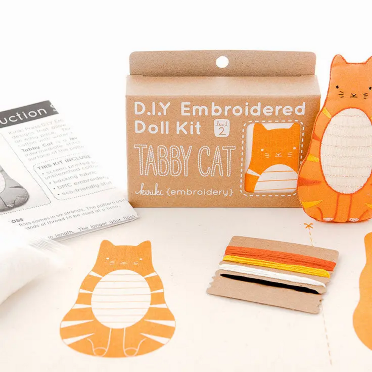 D.I.Y Embroidered Doll Kit for tabby cat with materials and instructions on a white background