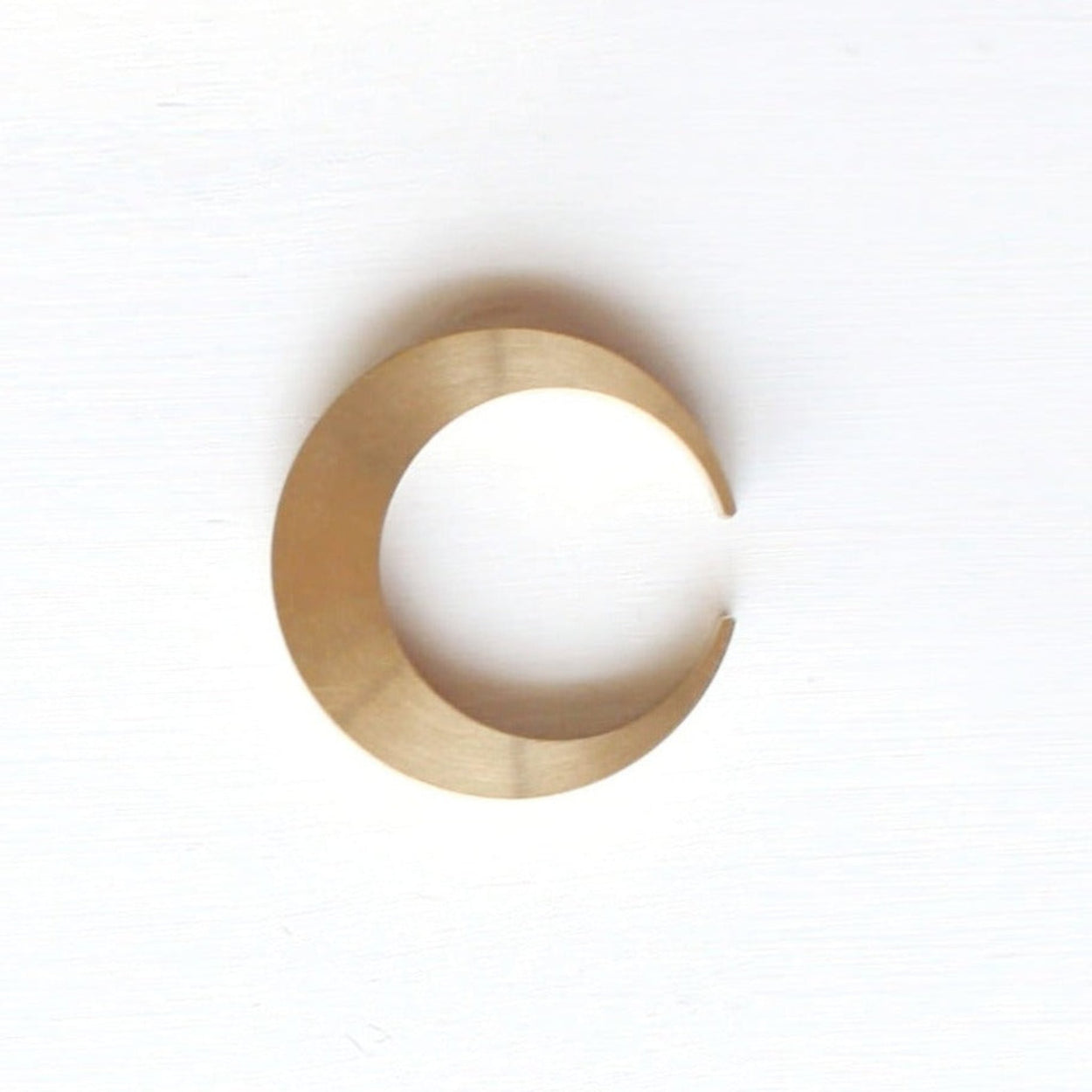 Futagami Crescent Bottle Opener on white background.