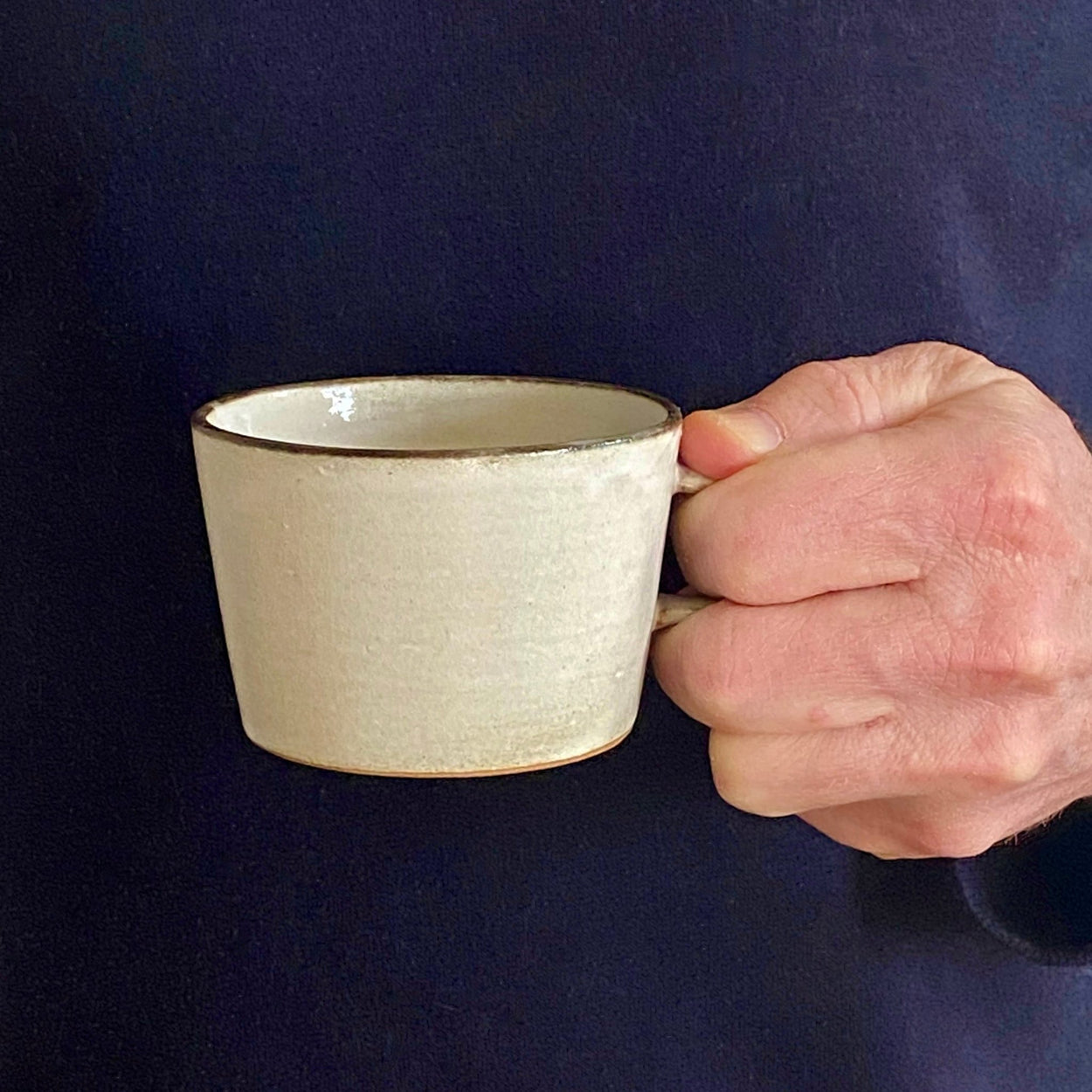 Man holding Japanese Ceramic Birch Cup.