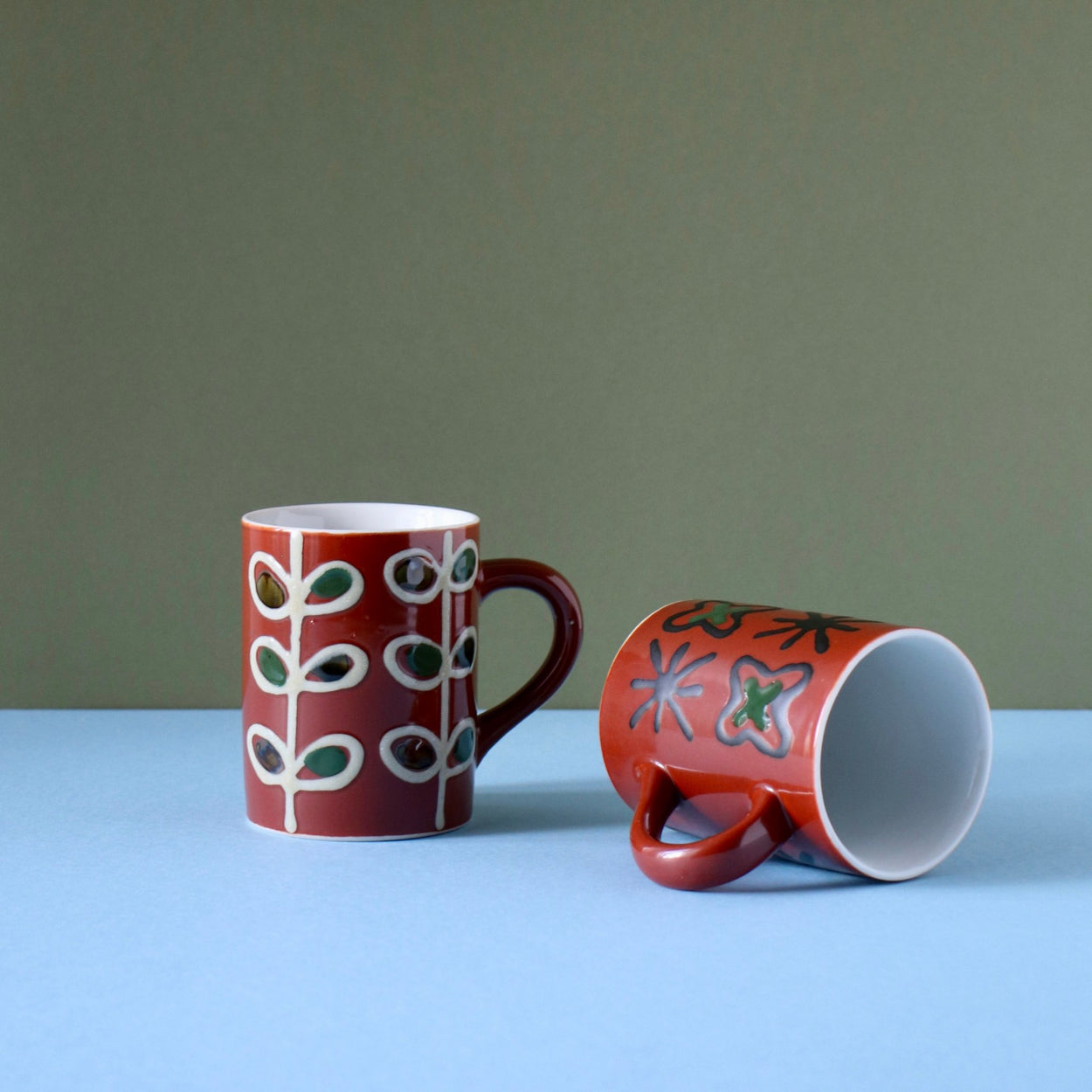 Vintage ceramic cups one lying on it's side