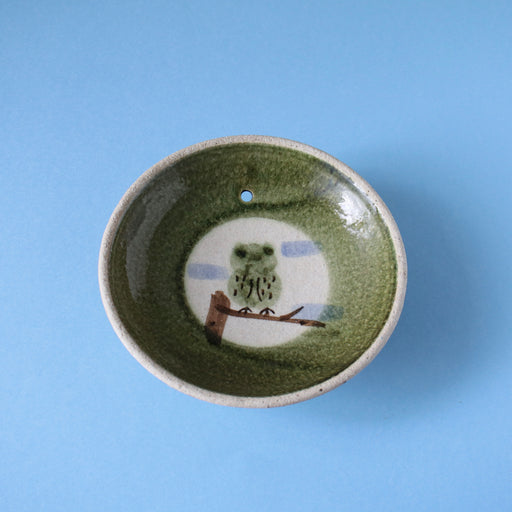 Vintage Japanese owl bowl incense holder with blue background