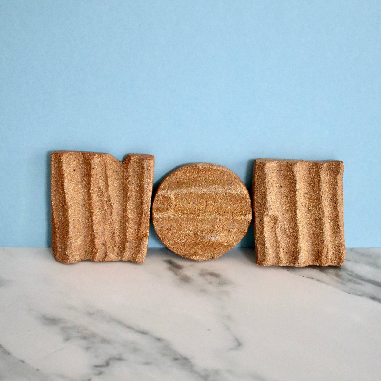 3 Ceramic Soap Holder by Grace McCarthy against blue and marble backdrop