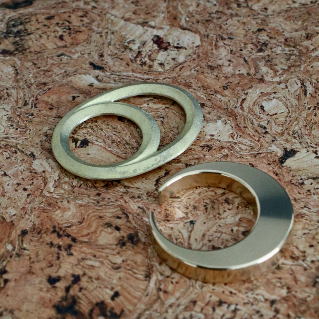 Futagami Eclipse and Crescent Bottle Openers on cork background.