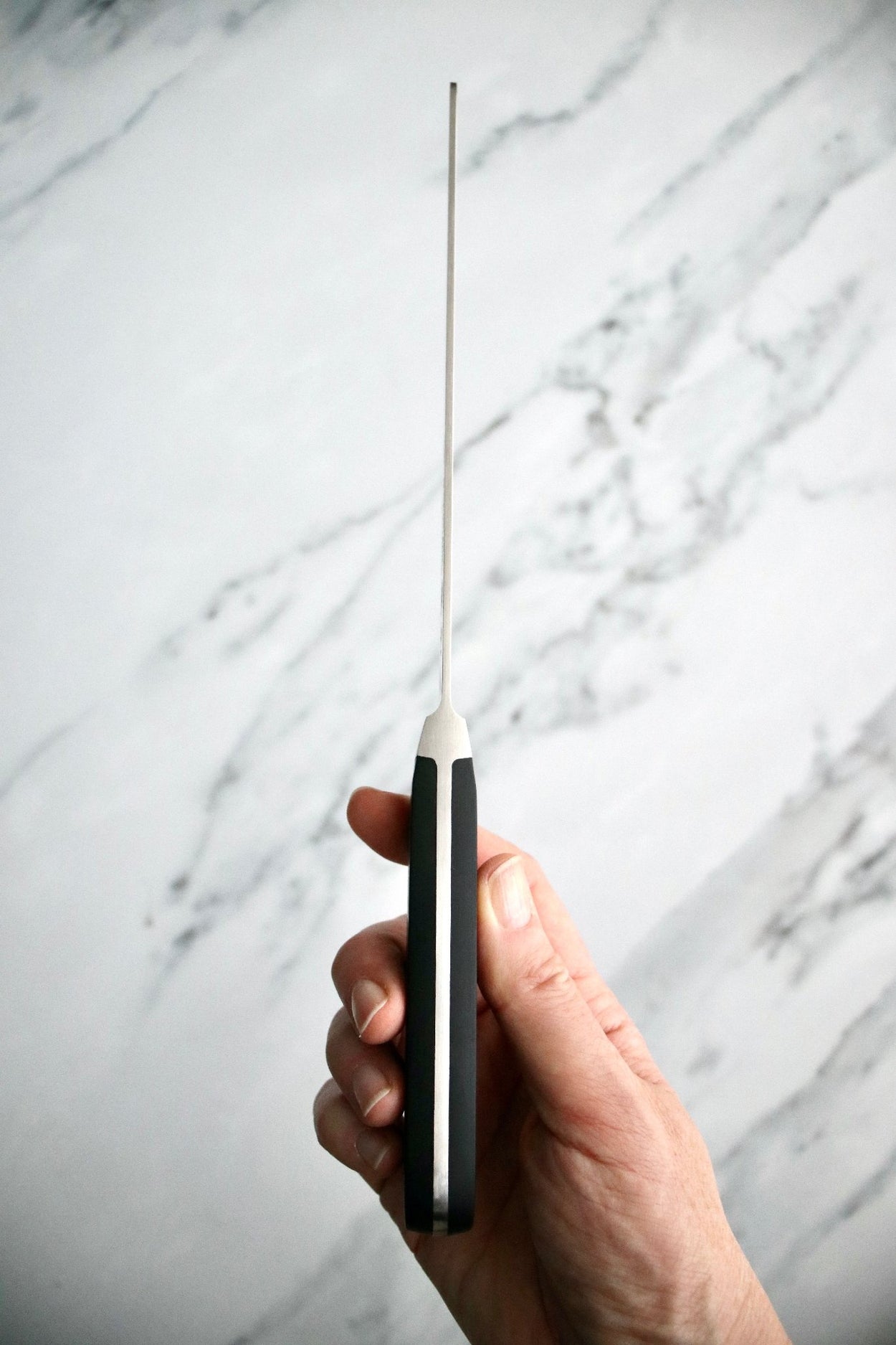 Friedr Herder Pikas 20cm Bread Knife on marble bench.