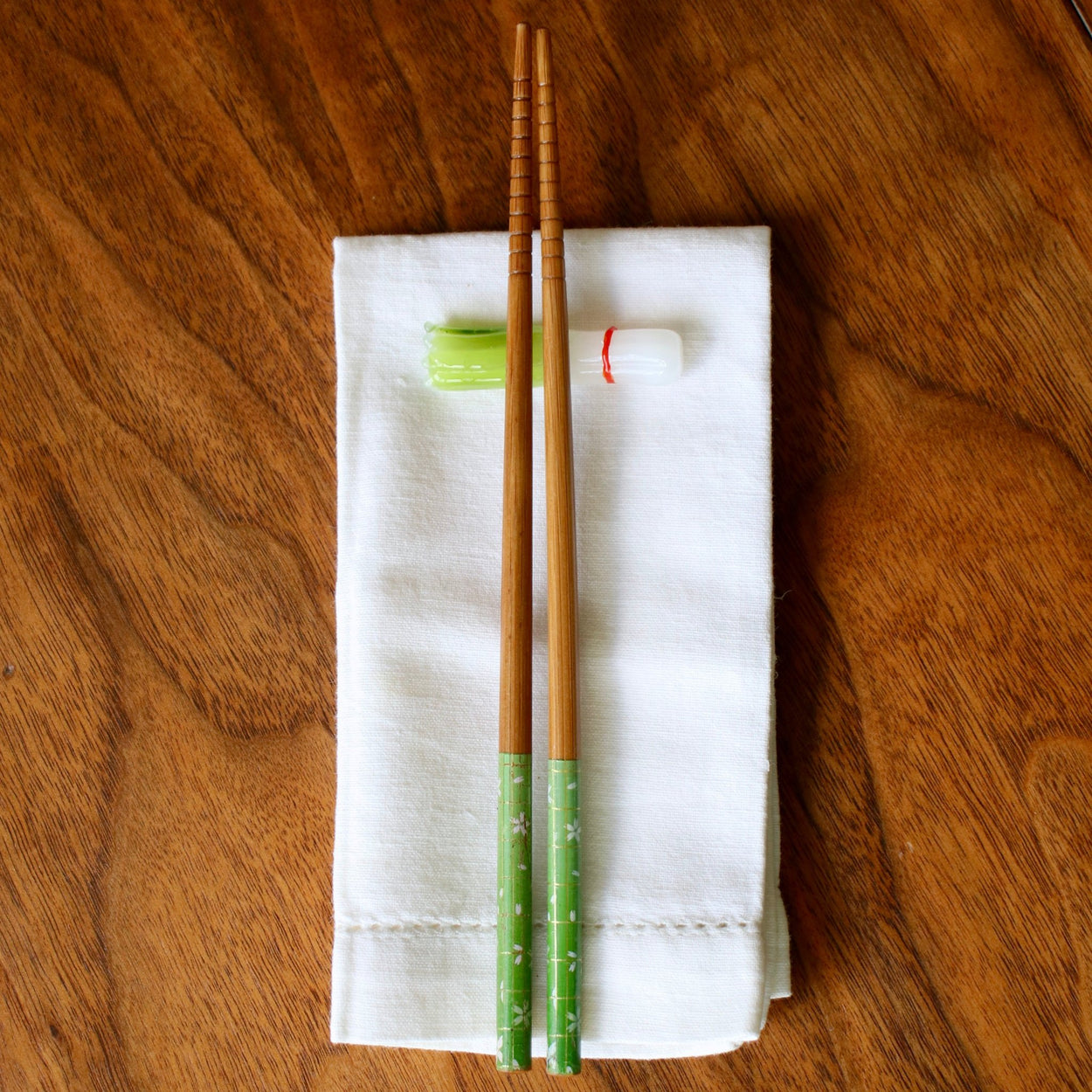 Vegetable Chopstick/Knife Rest, spring onion with chopsticks on napkin