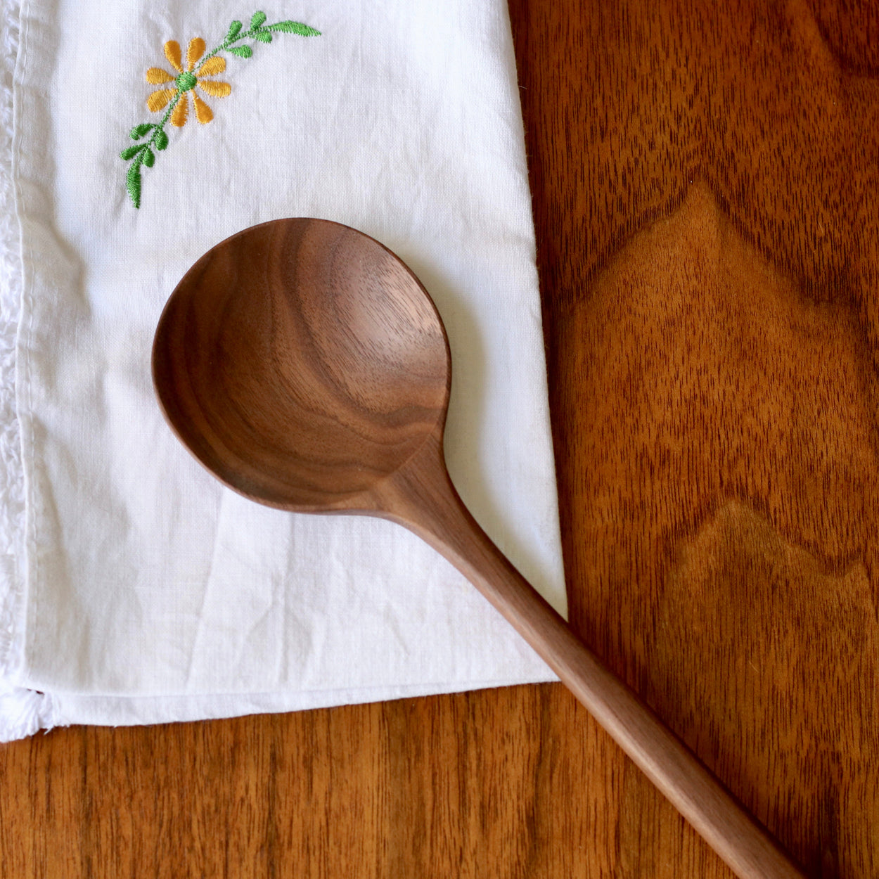 Close up of Hand crafted walnut wood spoon