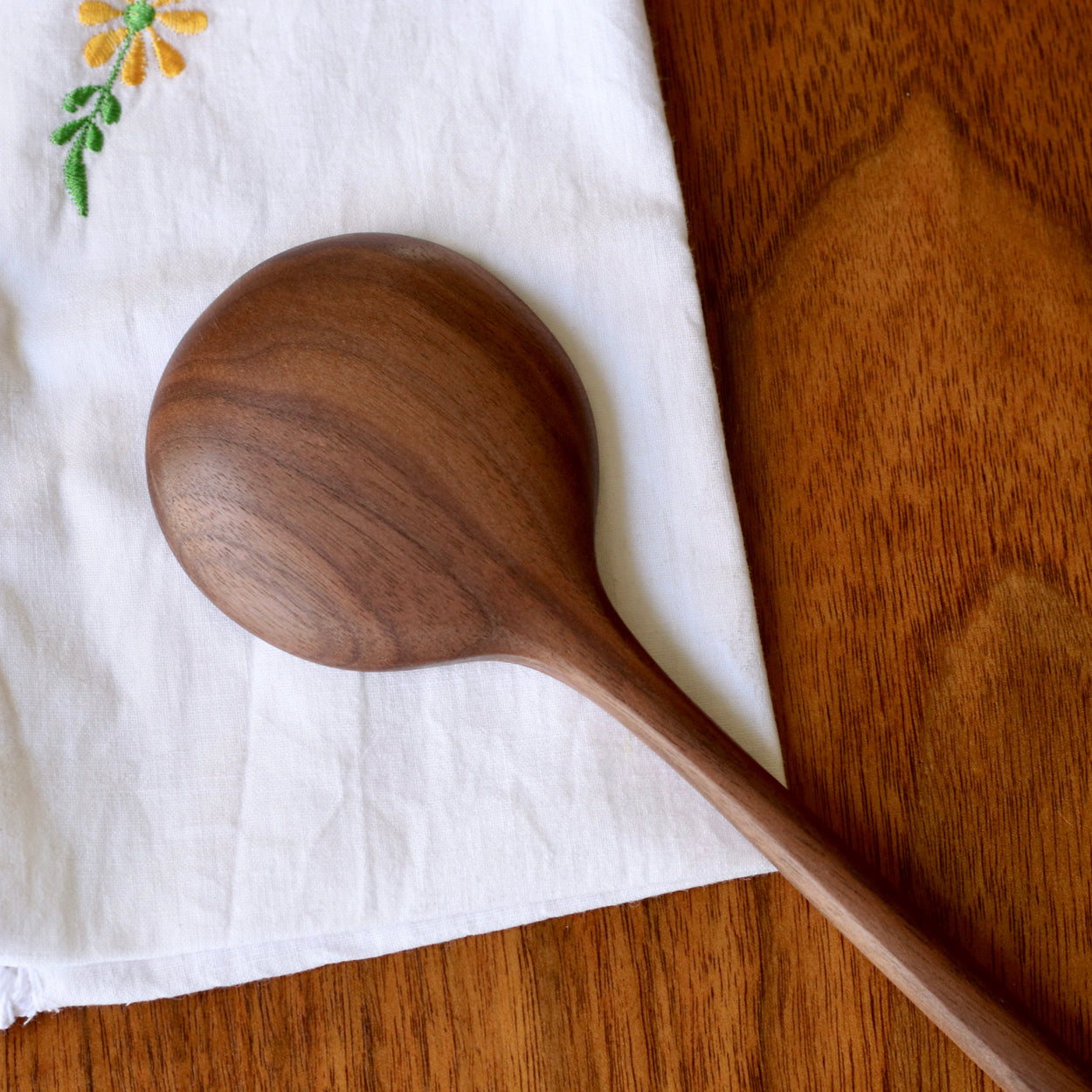 Close up of back of Hand crafted walnut wood spoon
