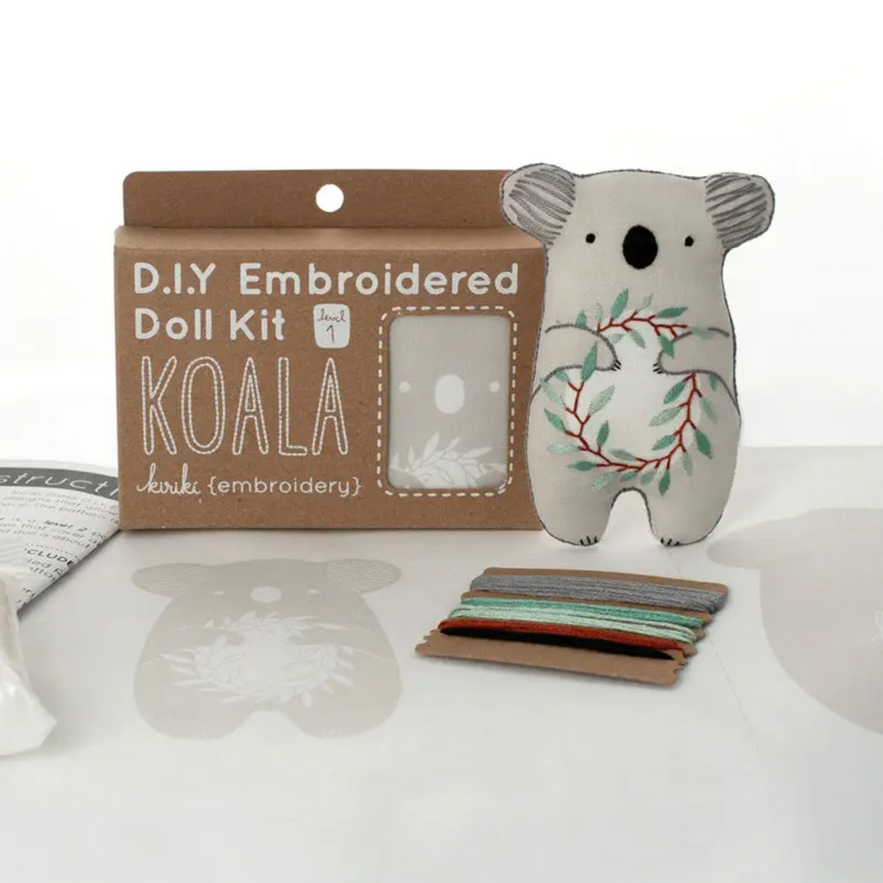 D.I.Y. Embroidered Doll Kit with a koala toy and materials on a white surface