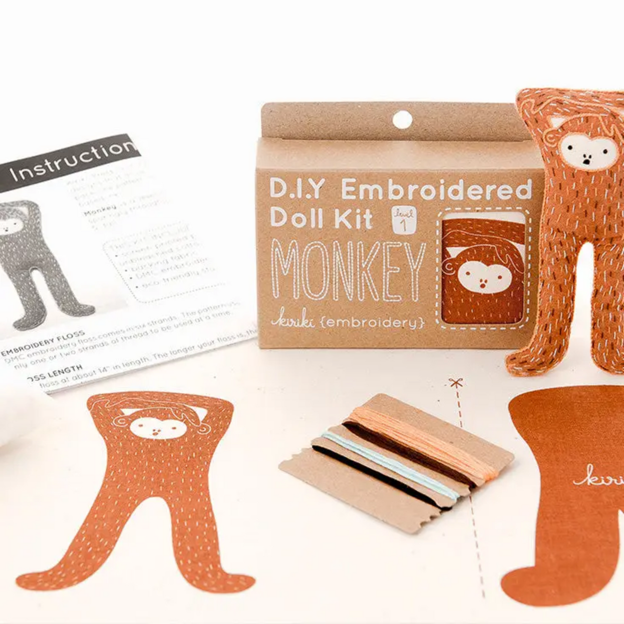 D.I.Y Embroidered Doll Kit with monkey design on a white background