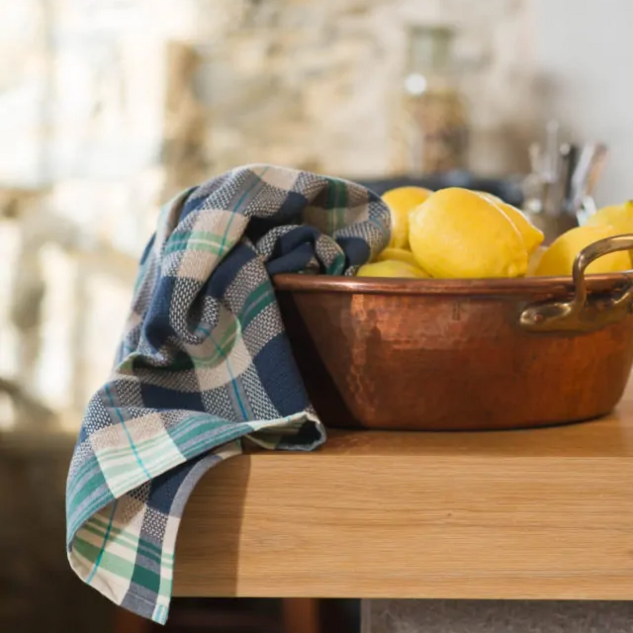 Mungo Vadoek Tea Towel in Cobalt with copper pot and lemons.
