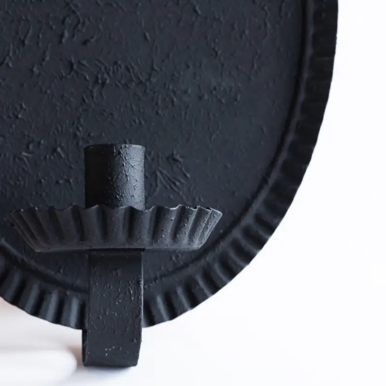 Close up of Oval candle sconce against grey background