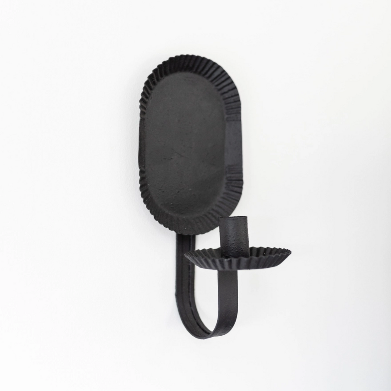 Black wall sconce on a white background