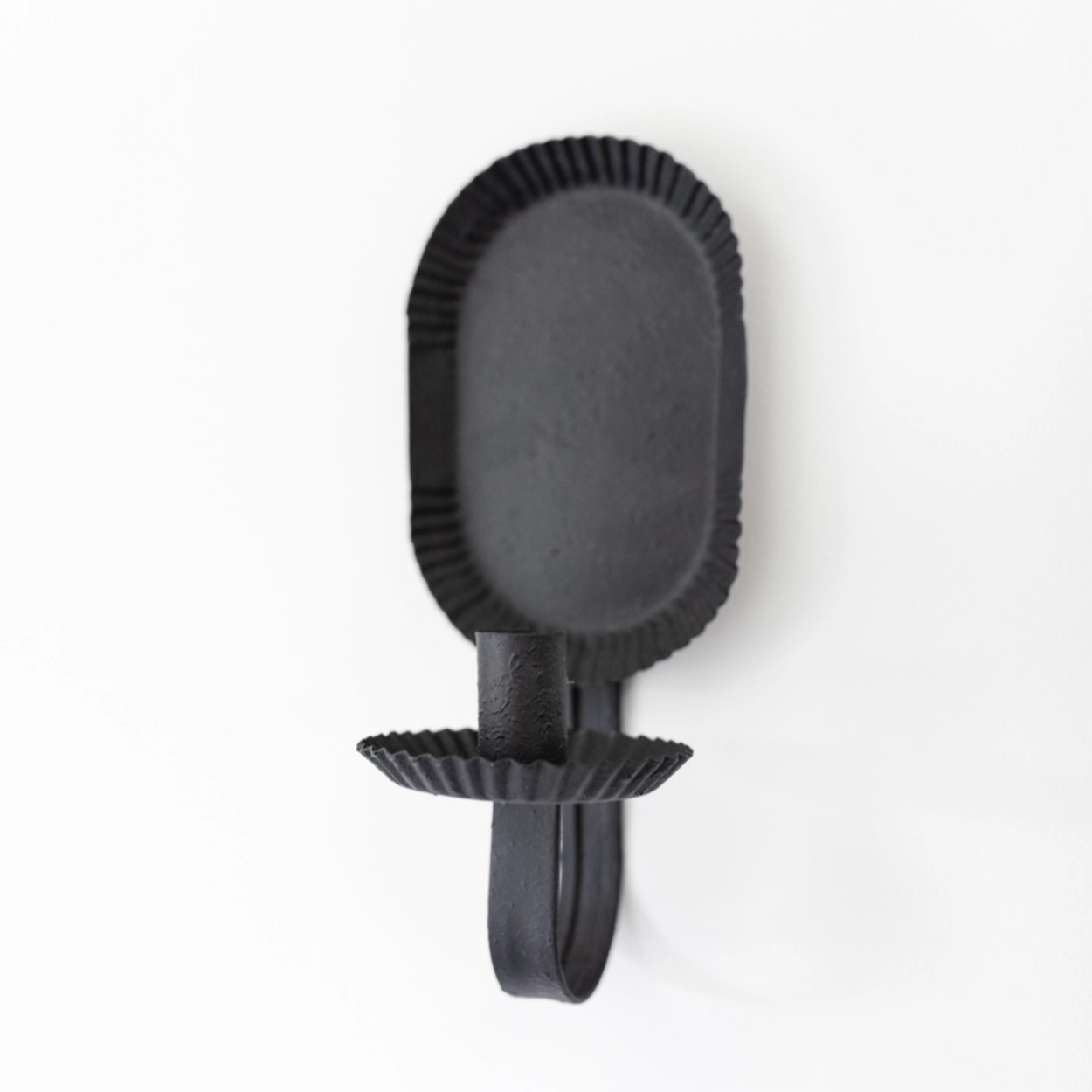 Amish Petit Candle Sconce wall-mounted on a light grey background