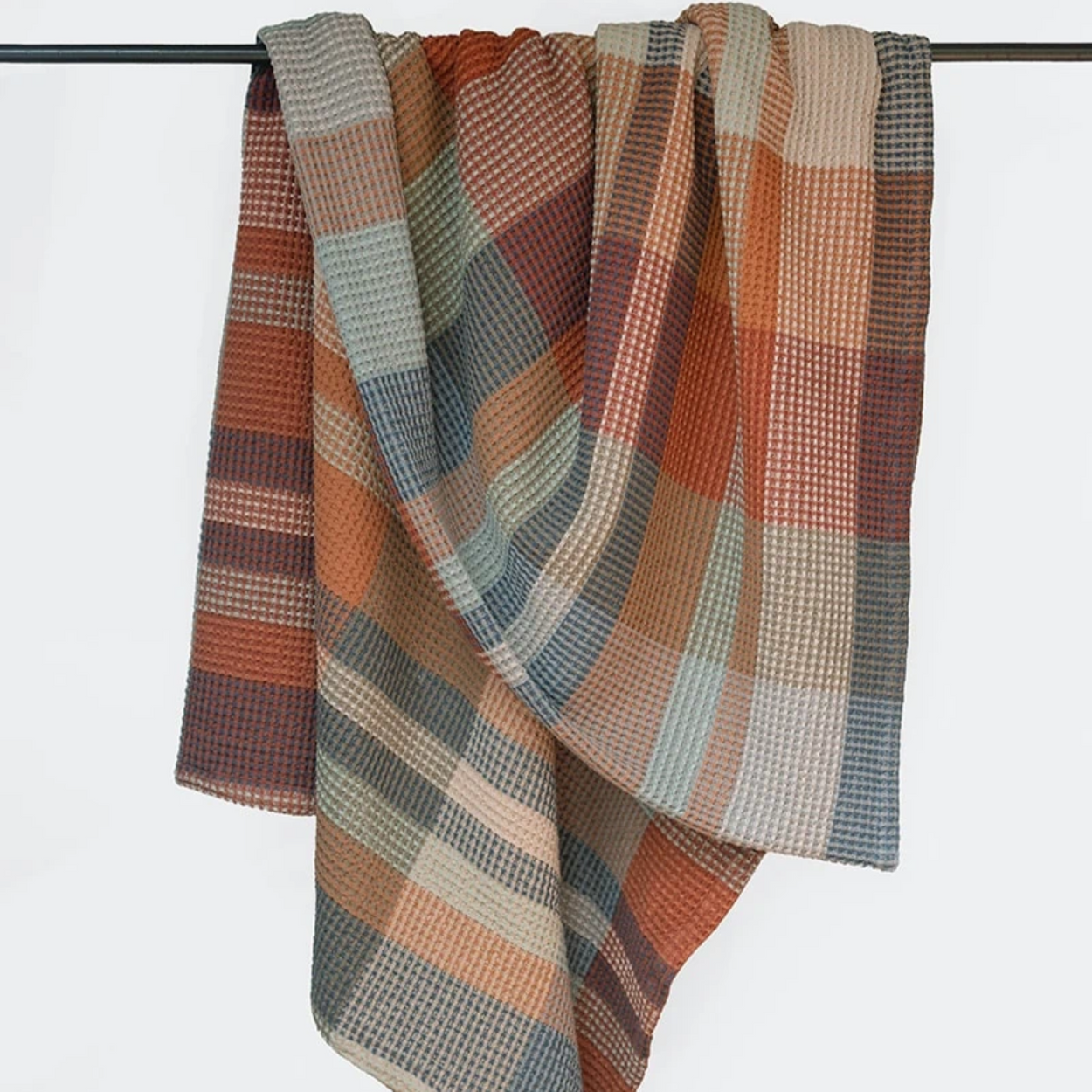 Mungo Vrou-Vrou Cotton Waffle Blanket - Cedarwood draped over rod