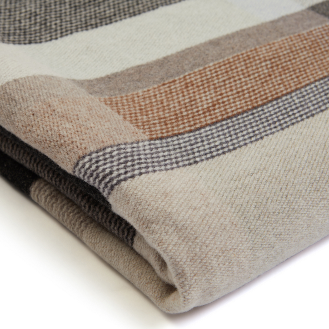 Wallace Sewell Premium Chippendale Merino lambswool throw in pale brown tones closeup folded.