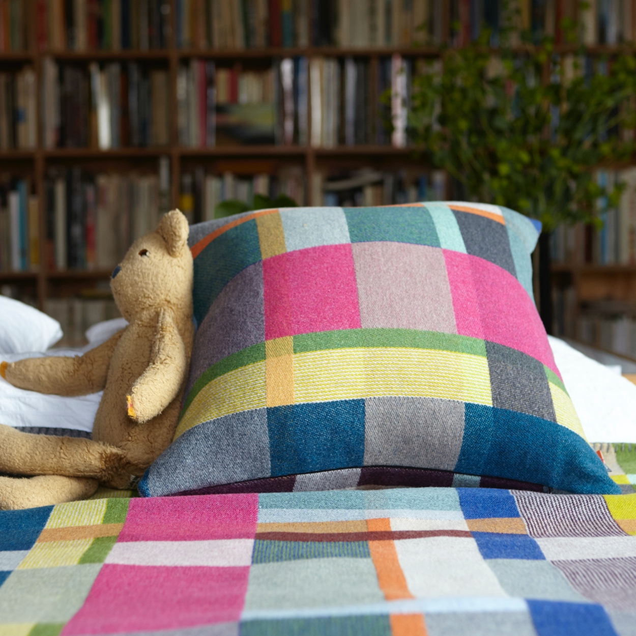 Premium Australian Merino Wool Cushion cover - Gwynne with Block blanket, Gwynne on bed with teddy bear.