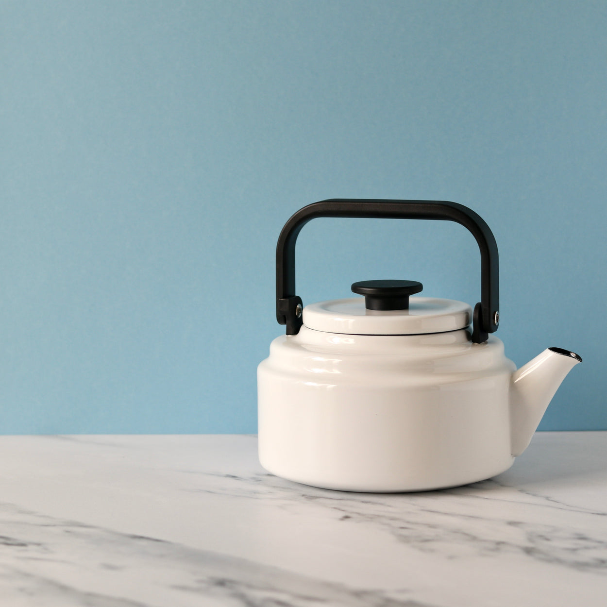 Japanese Noda Horo Amu Kettle - White against pale blue background