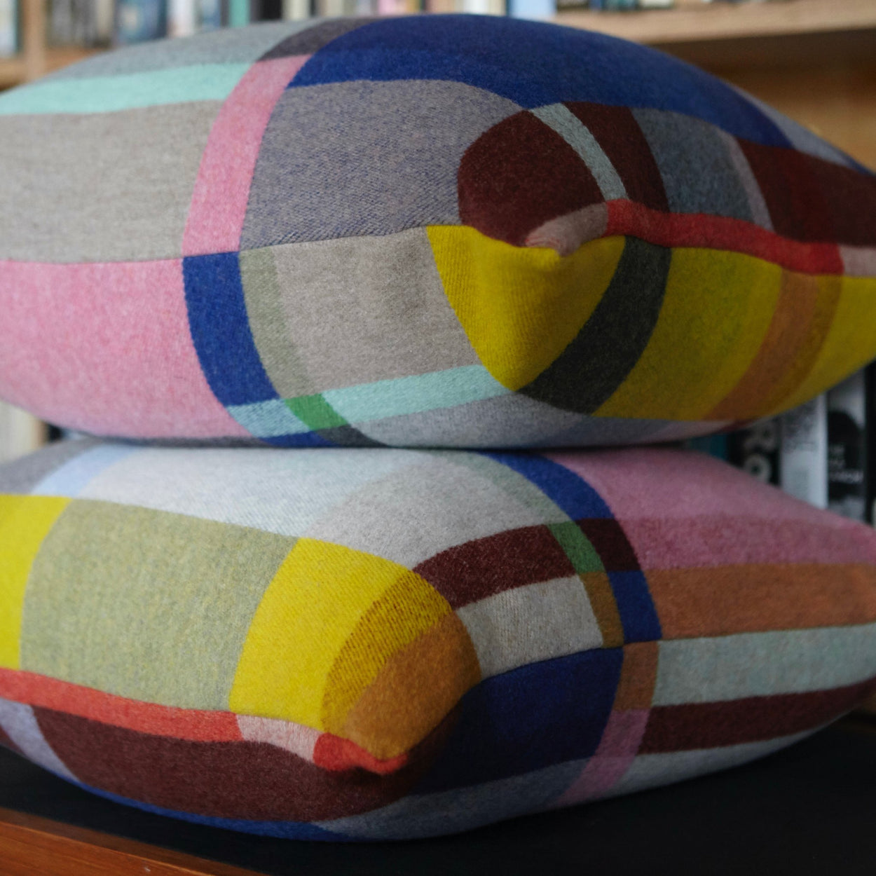 Premium Merino wool cushion cover in Lloyd with blankets on buffet top.