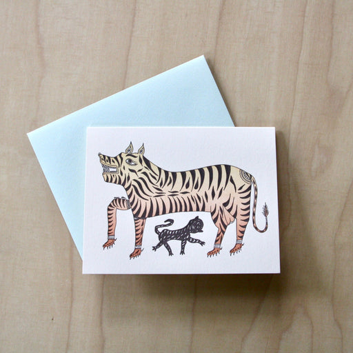 Tiger Letterpress Greeting Card with pale blue envelope on pale wood.