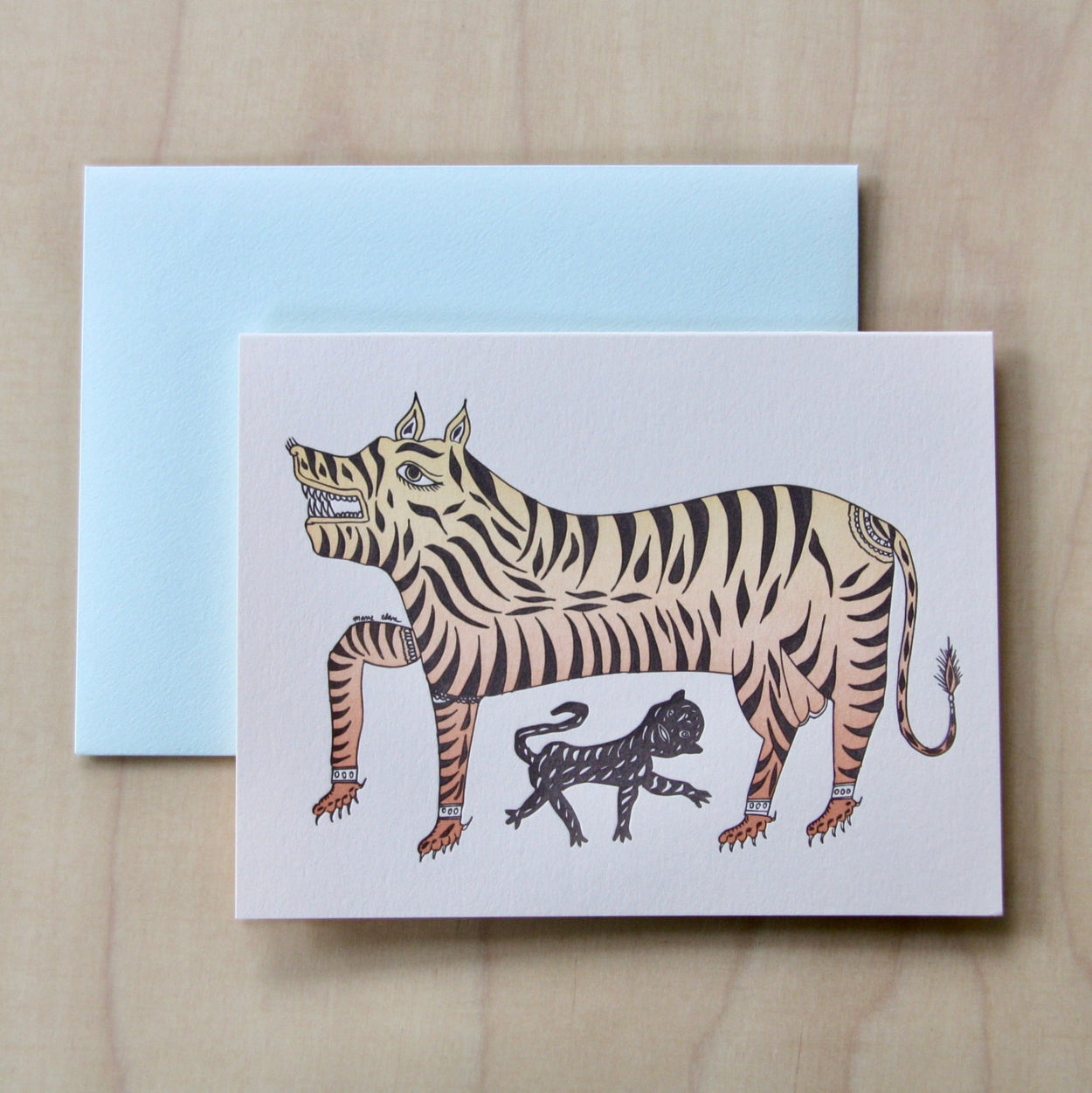 Tiger Letterpress Greeting Card with pale blue envelope on pale wood.
