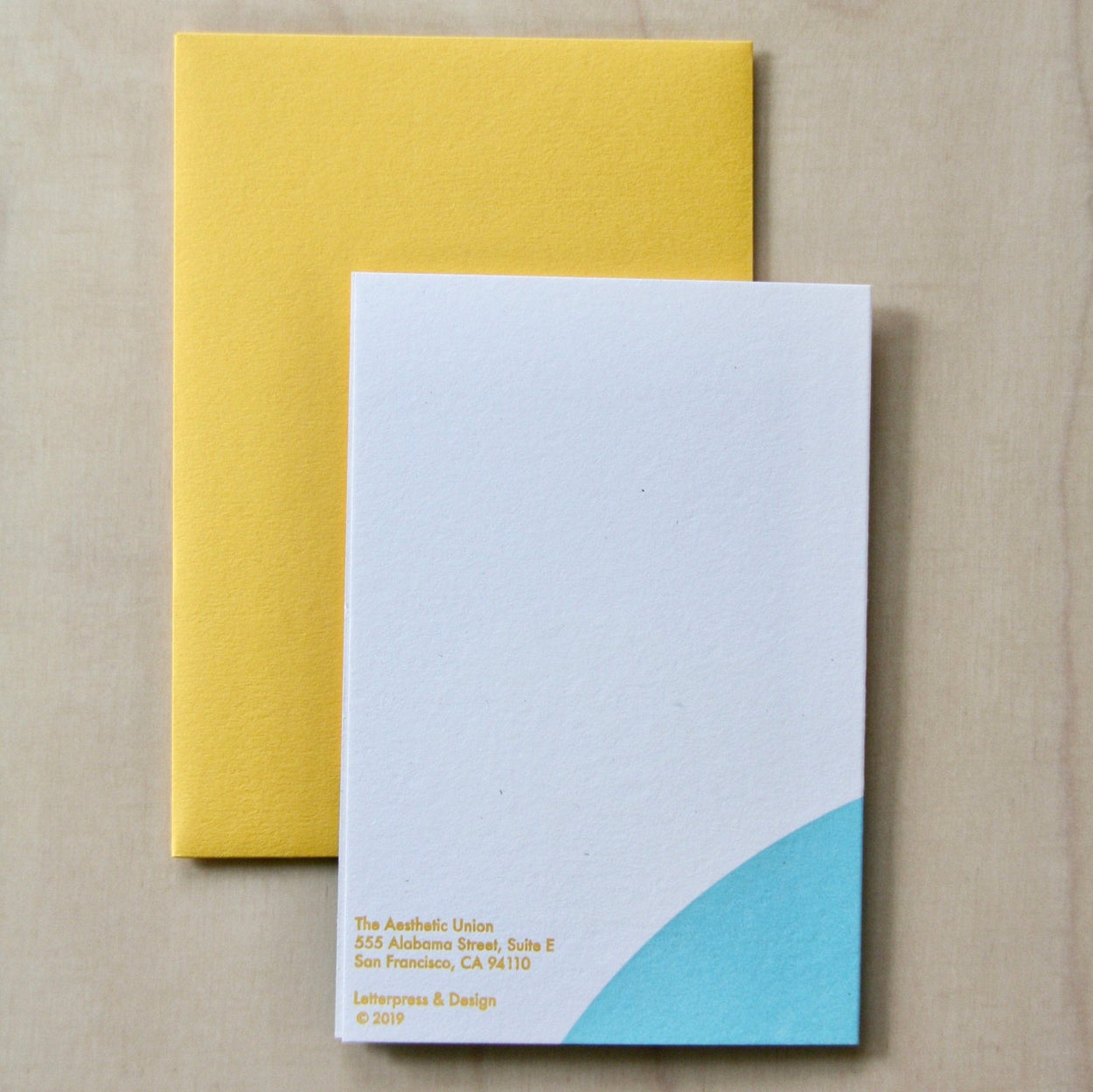 Back of Hand printed greeting card with yellow sun and blue curve on a yellow envelope. reading "Three things cannot be long hidden, the sun, the moon and the truth" Buddha