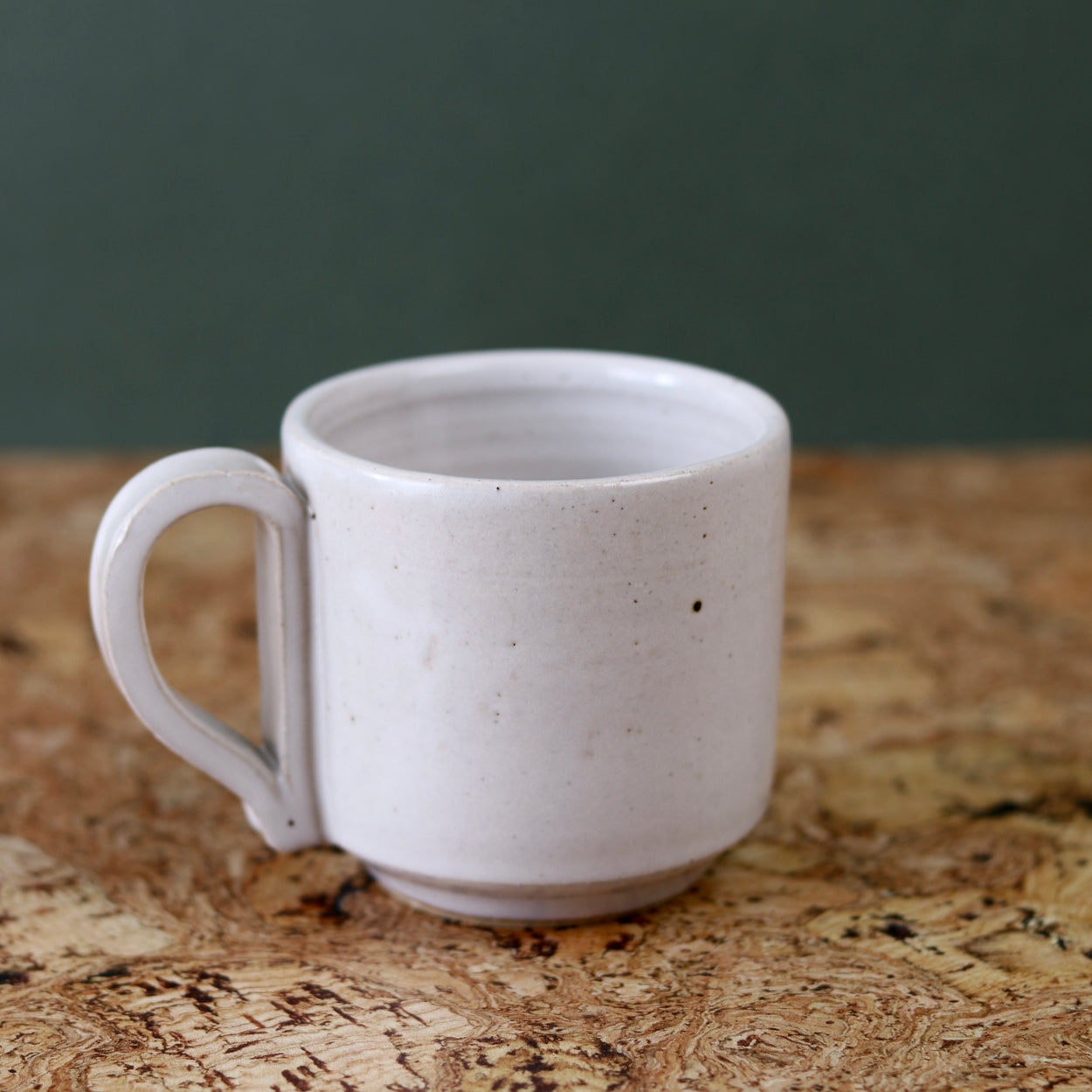 Handmade Ceramic Coffee Mug - Large by Richard Beauchamp on cork background.