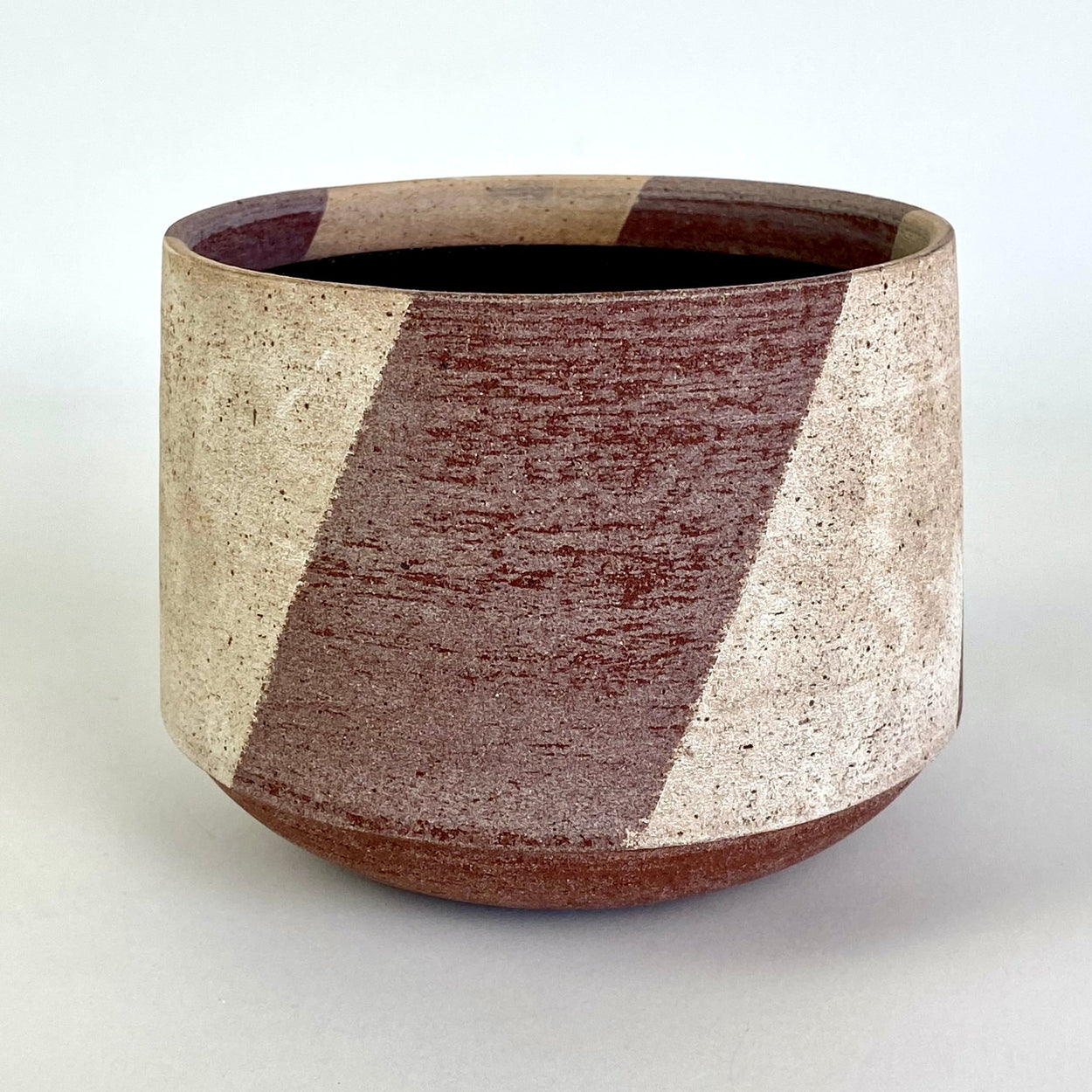 Ceramic Stripe Bowl by Amanda-Sue Rope with white background.
