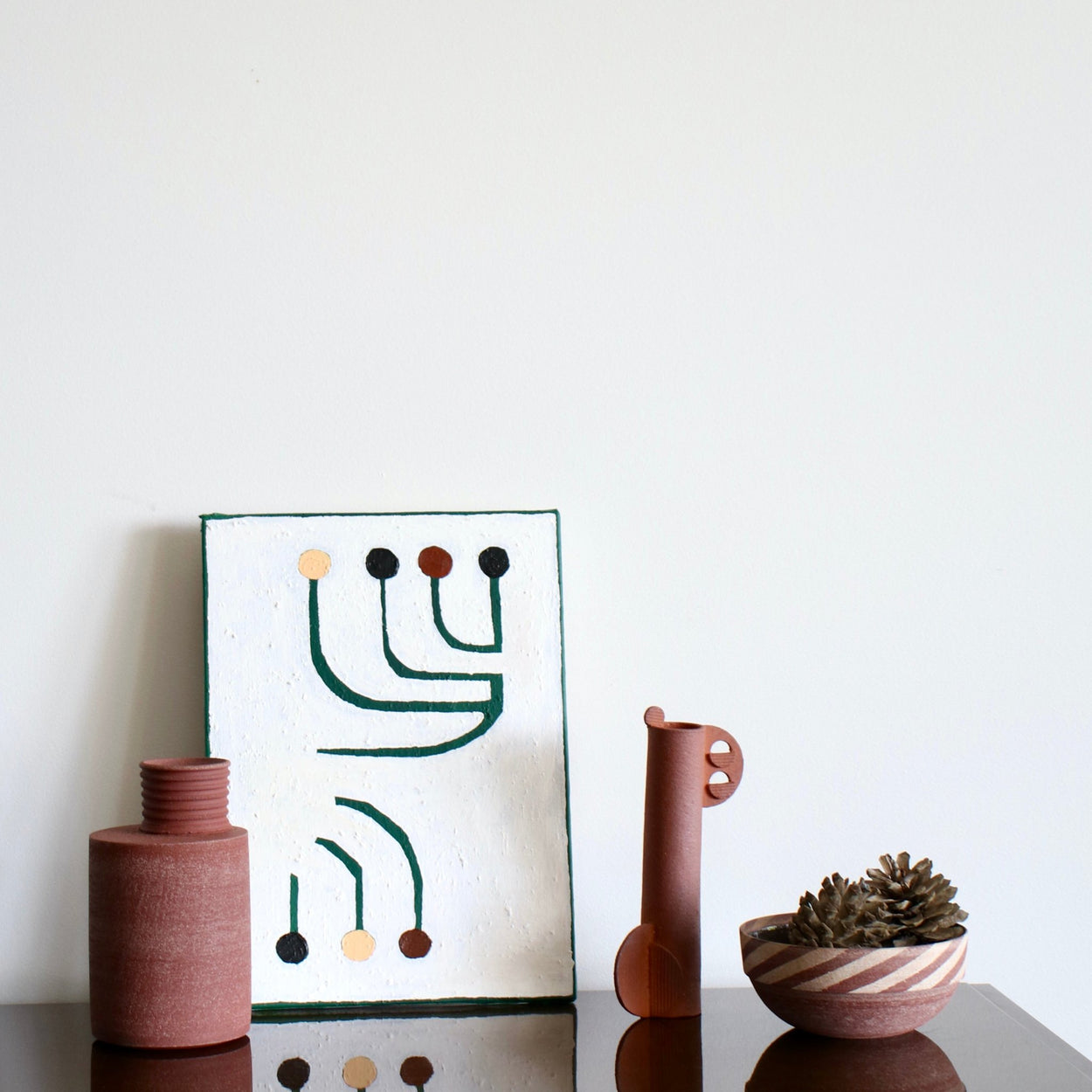 Cassie Hansen Tall Sculpture with tall ceramic vase and striped bowl by Amanda Sue Rope, with abstract painting