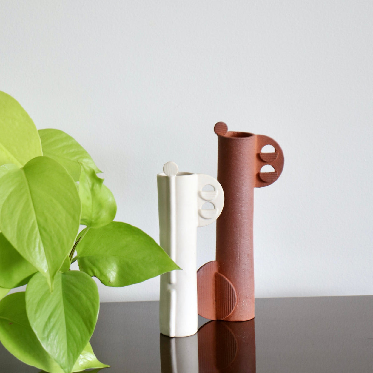 Cassie Hansen Tall vase with terracotta sculpture