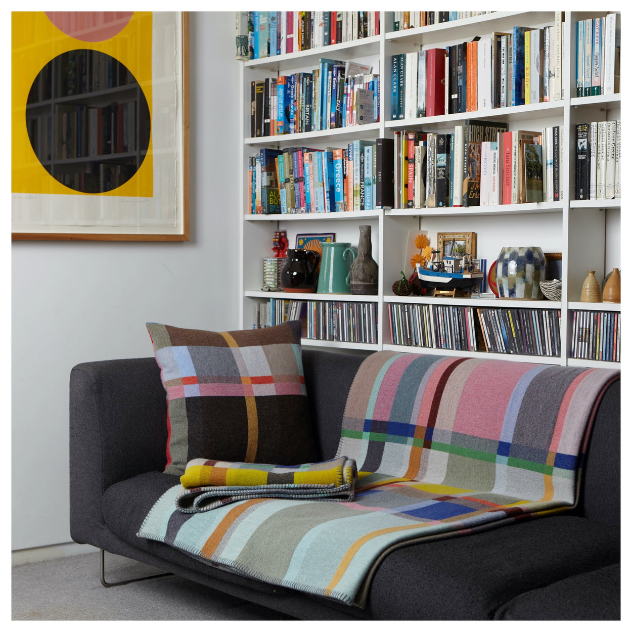 Premium Merino Lambswool Throw Blanket - Lloyd in pink and blue on couch with cushions