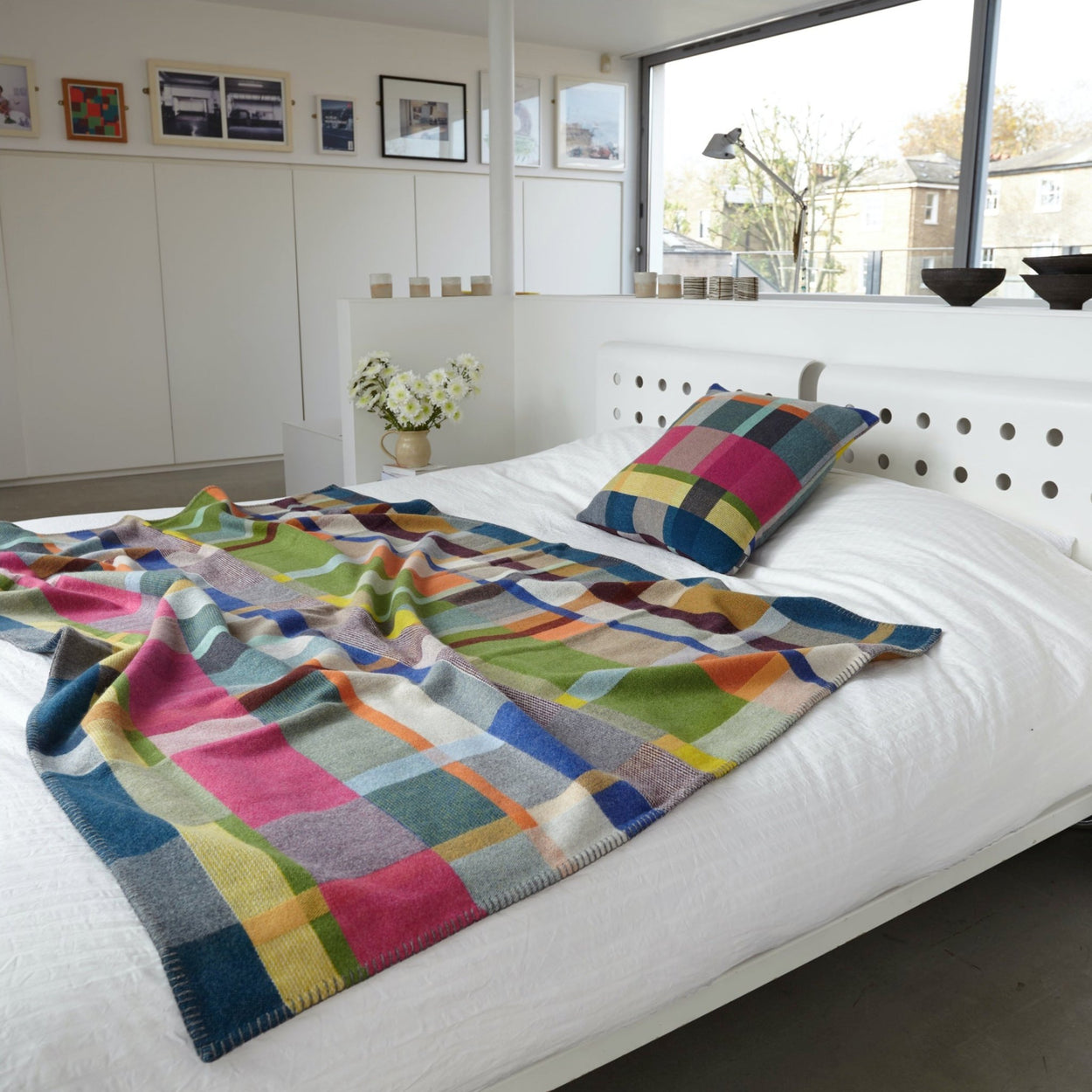 Premium Australian Merino Wool Throw Blanket in bright pink and blue on bed
