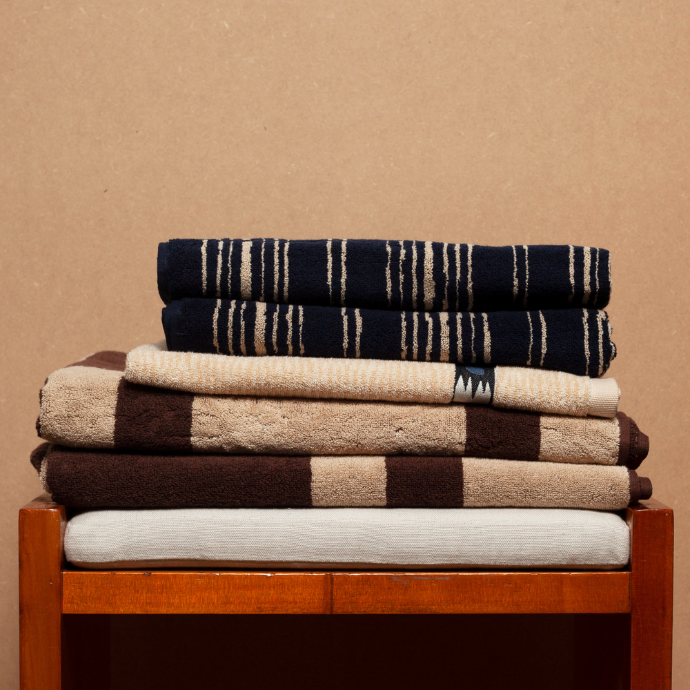 Atumn Sonata Karin bath towels on wooden stool