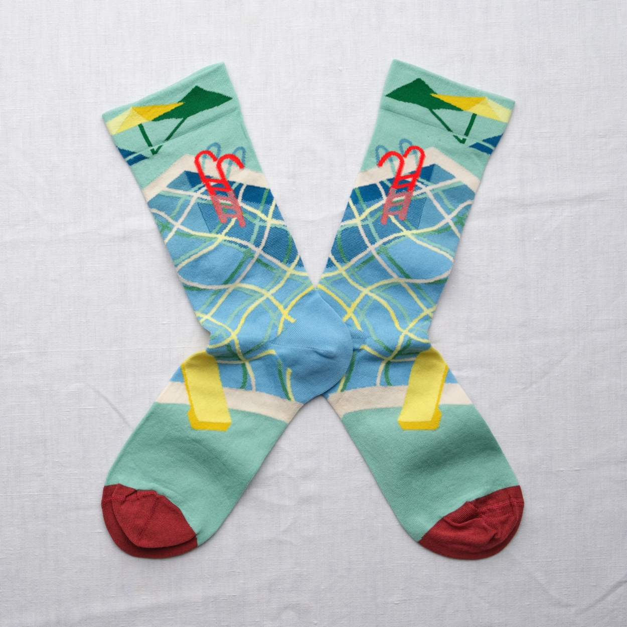 Bonne Maison Swimming Pool socks against a white backdrop.
