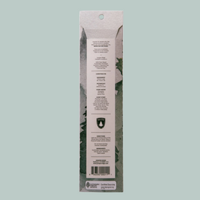 The back of a tall, narrow product package shown against a solid light gray background. The package has a white center label with black text, a small green shield logo, and a barcode near the bottom.