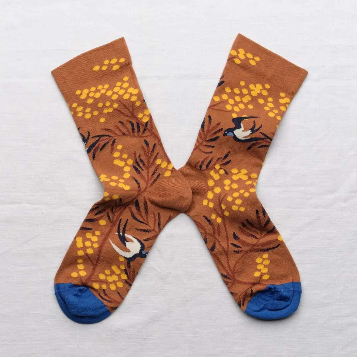 Caramel Mimosa Bonne Maison socks on white backdrop.