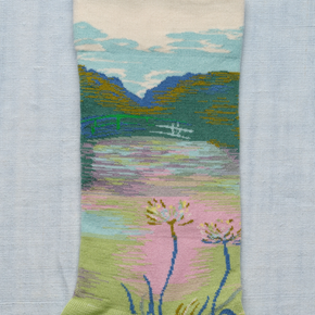 Close up of Garden Bonne Maison socks on white backdrop.