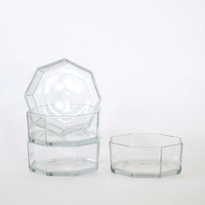 Set of hexagonal glass containers on a white background