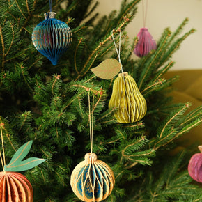 Decorative Christmas ornaments on a tree with a blurred background