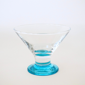 Clear glass with blue base on a white background