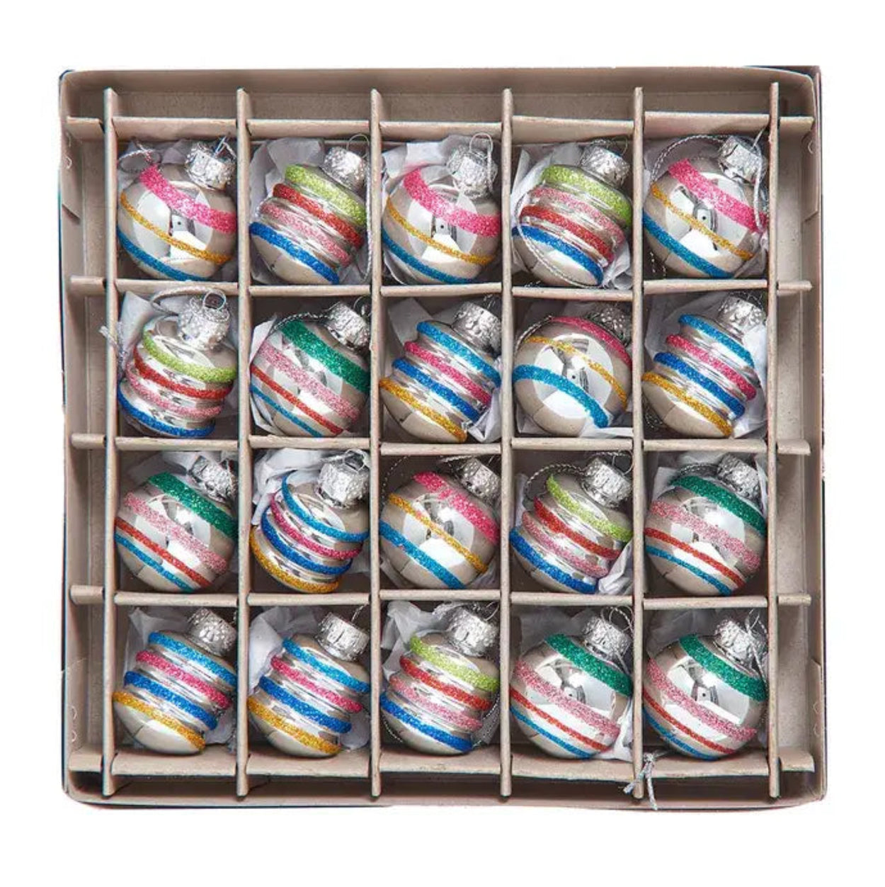 Box of multicolored striped Christmas ornaments on a white background