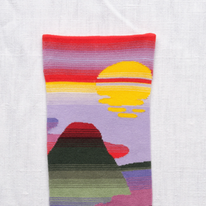 Close up of Bonne Maison Mauve Passage socks on white backdrop.