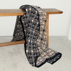 Autumn Sonata Bath Towel - Alma draped over wooden stool